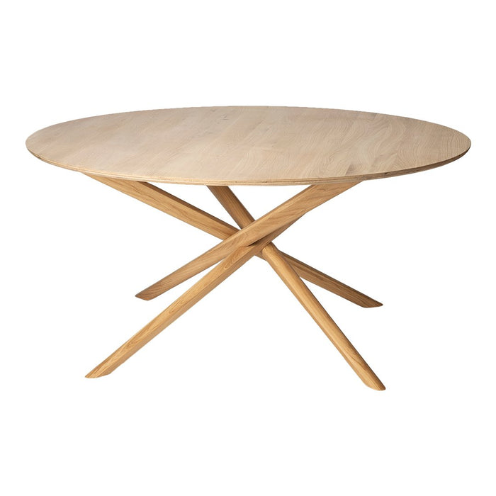 Natural wood round table with a light finish and minimalist design, featuring crisscross legs in beige tones.