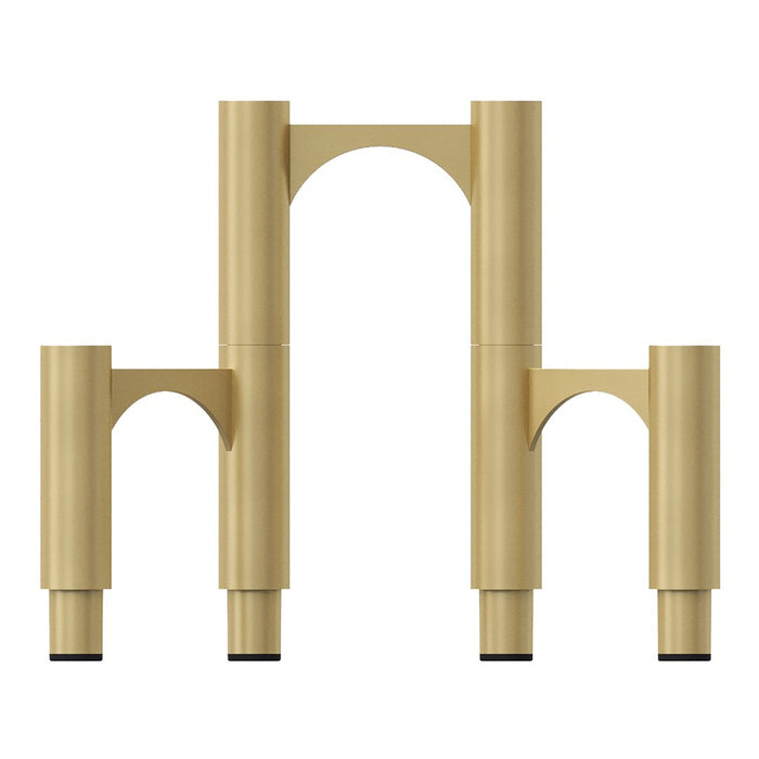 Gold candle holder with three tall black candles, featuring a sleek, modern design and simple geometric shapes.