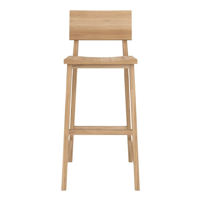 Natural wood bar stool with a minimalist design and light oak finish, showcasing a smooth, warm texture.