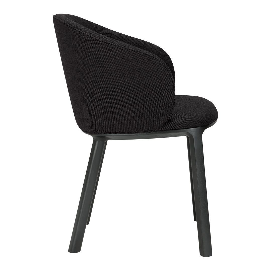 Black upholstered chair with a smooth texture and light gray legs. Stylish minimalist design suitable for modern decor.