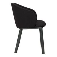 Black upholstered chair with a smooth texture and light gray legs. Stylish minimalist design suitable for modern decor.