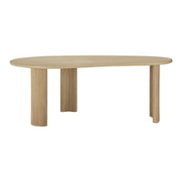 Light oak oval dining table with textured vertical ribbed legs, featuring a minimalistic and modern design.