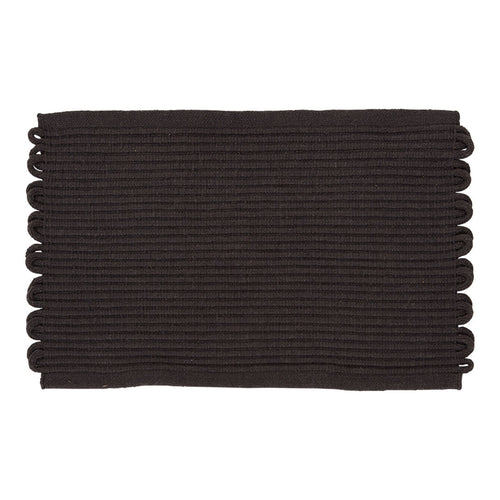 Black rectangular mat with textured ridges and decorative scalloped edges. Perfect for modern decor.