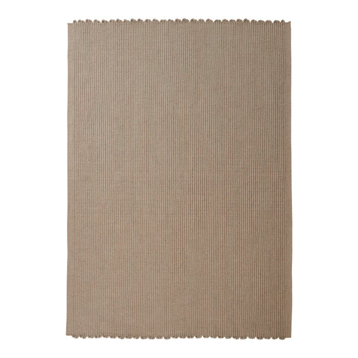 Beige linen placemat with a textured surface and scalloped edges. Perfect for elegant dining decor.