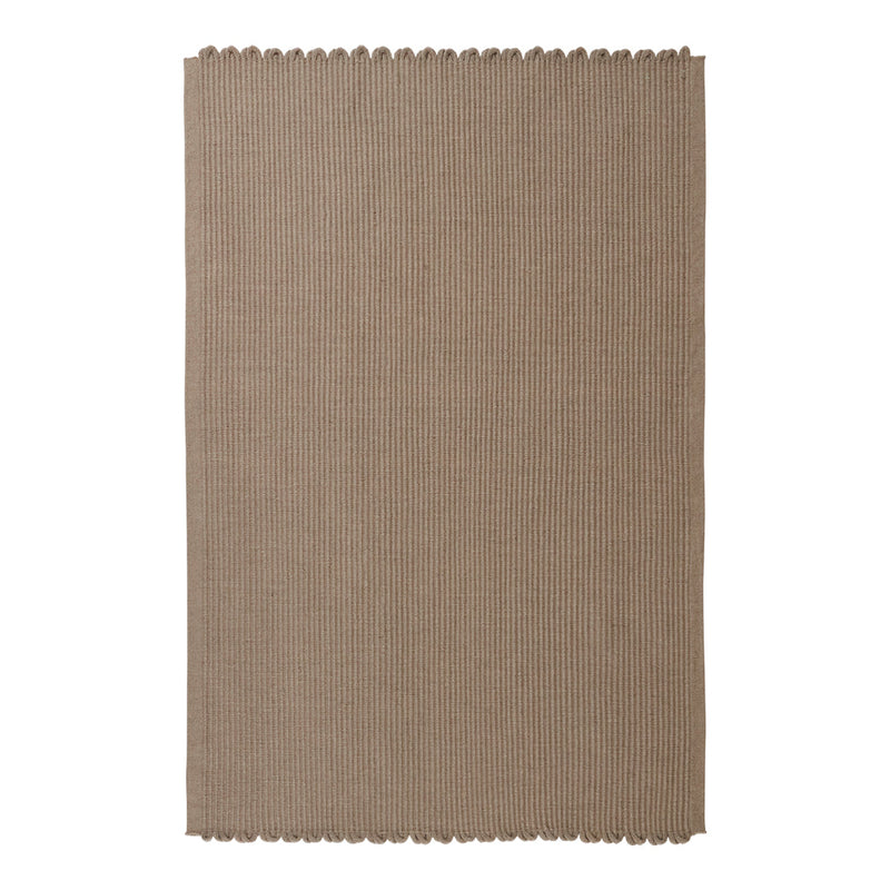 Taupe woven rug with a subtle texture and scalloped edges, ideal for adding warmth to any space.