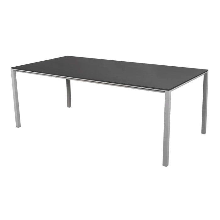 Rectangular dining table with a sleek black top and silver metal legs, featuring a modern minimalist design.