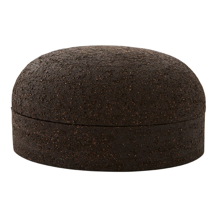 Round brown cork container with a textured surface, featuring a smooth, dome-shaped lid.