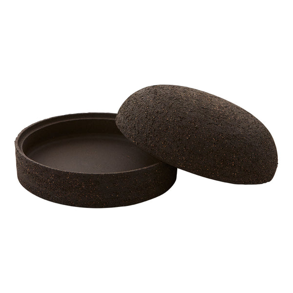 Dark brown circular container with a textured surface and smooth interior, featuring an elegant, minimalist design.
