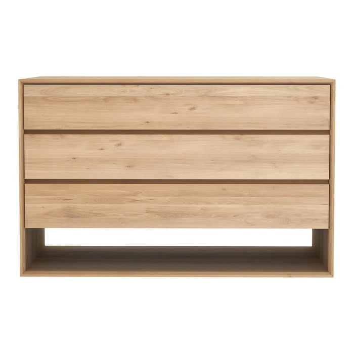 Natural light wood dresser with four smooth, horizontal drawers and a minimalist design, featuring a soft grain pattern.