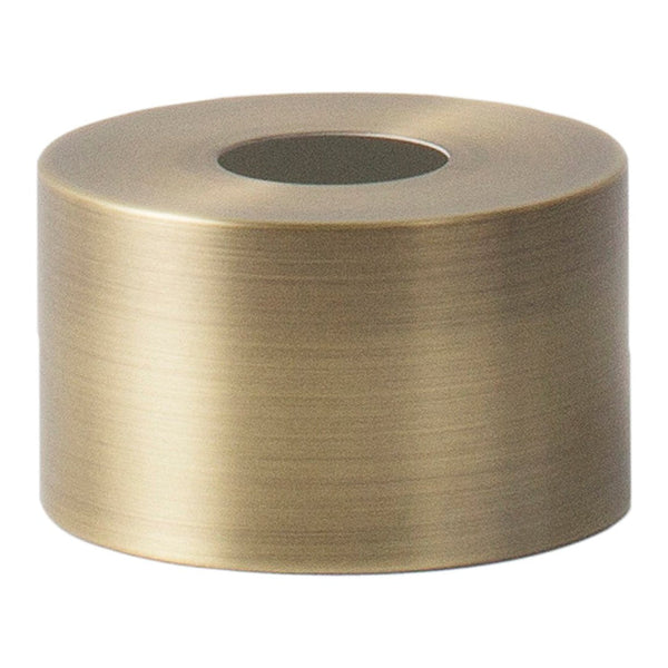 Brushed brass cylindrical tape roll with a smooth, reflective metallic surface and a central hole for easy usage.