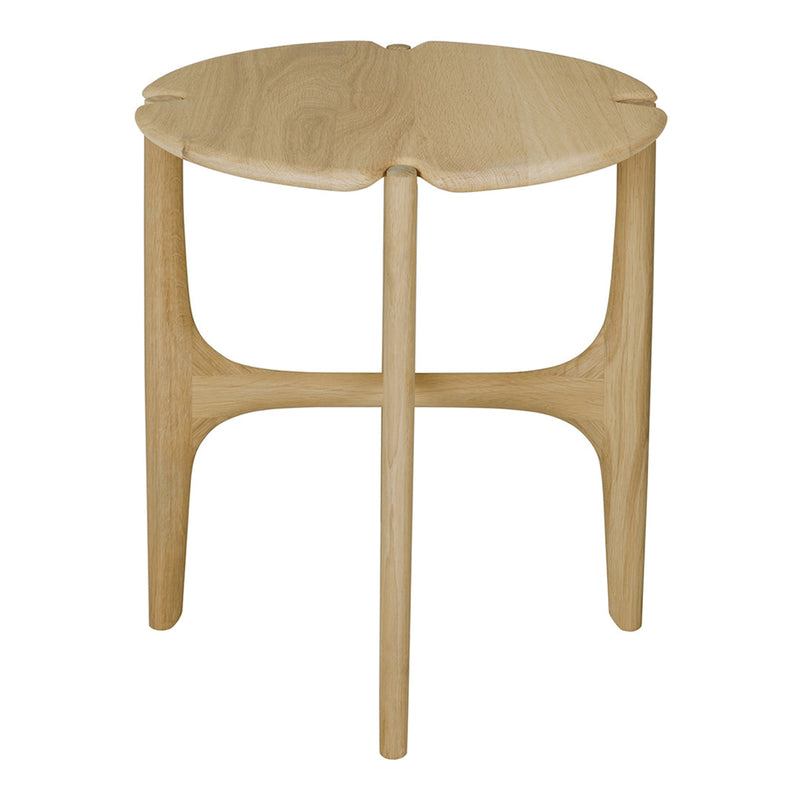Natural wood accent table with a unique leaf-shaped top and smooth finish, showcasing light beige tones and minimal design.