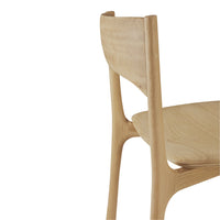Light natural wood chair with smooth curves and minimalistic design, showcasing a clean, modern aesthetic.