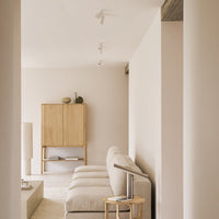 Neutral beige tones with soft textures; minimalist furniture against a light, calming background for a serene ambiance.