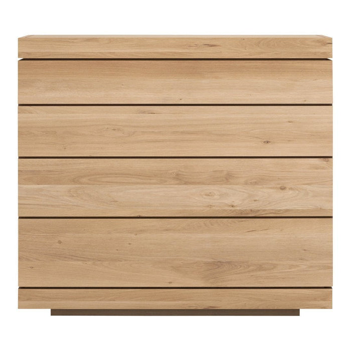 Light natural wood dresser with a smooth, minimalist design and horizontal grain patterns.