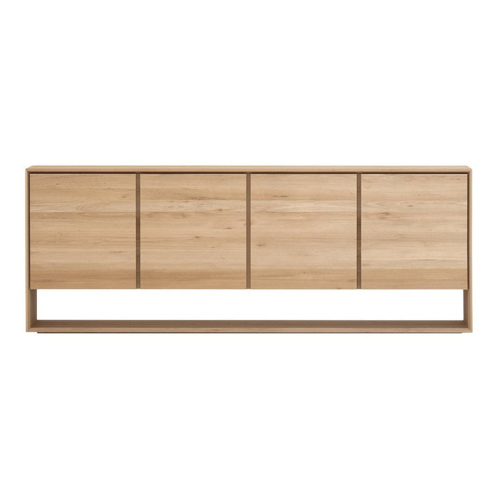 Natural wood grain sideboard in light oak finish with sleek, minimal design and four spacious drawers.
