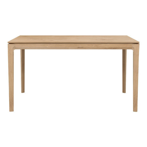 Natural wood finish dining table with a smooth surface and sturdy, minimalist design in light beige tones.