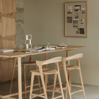 Natural wood tones with a warm beige backdrop, featuring minimalist clear acrylic accents and soft, light textures.