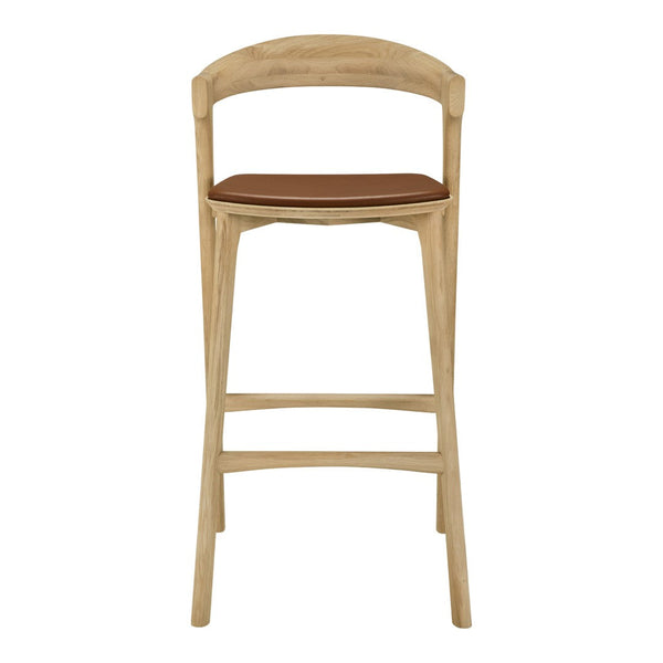 Light natural wood bar chair with a warm brown leather seat. Simple, modern design with minimal patterns.