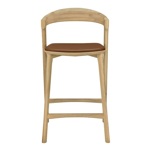 Natural wood frame with a light oak finish and a warm brown leather seat. Modern, minimalist design.
