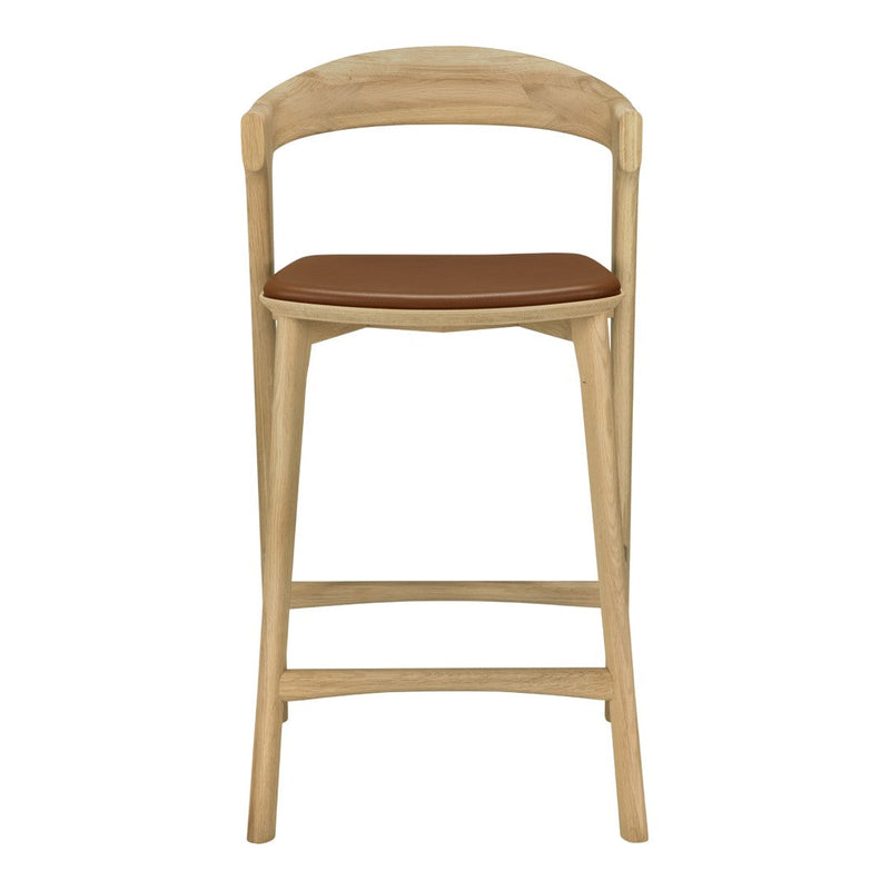Natural wood frame with a light oak finish and a warm brown leather seat. Modern, minimalist design.