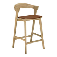 Natural wood bar stool with a light oak finish and a rich brown leather seat cushion. Sleek, modern design.