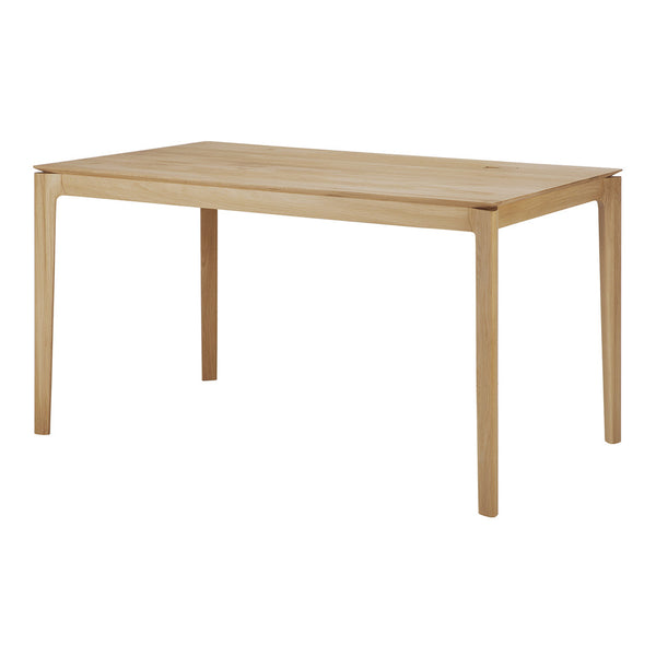 Natural wood dining table in light oak finish, featuring a smooth surface and minimalist design. Ideal for modern decor.