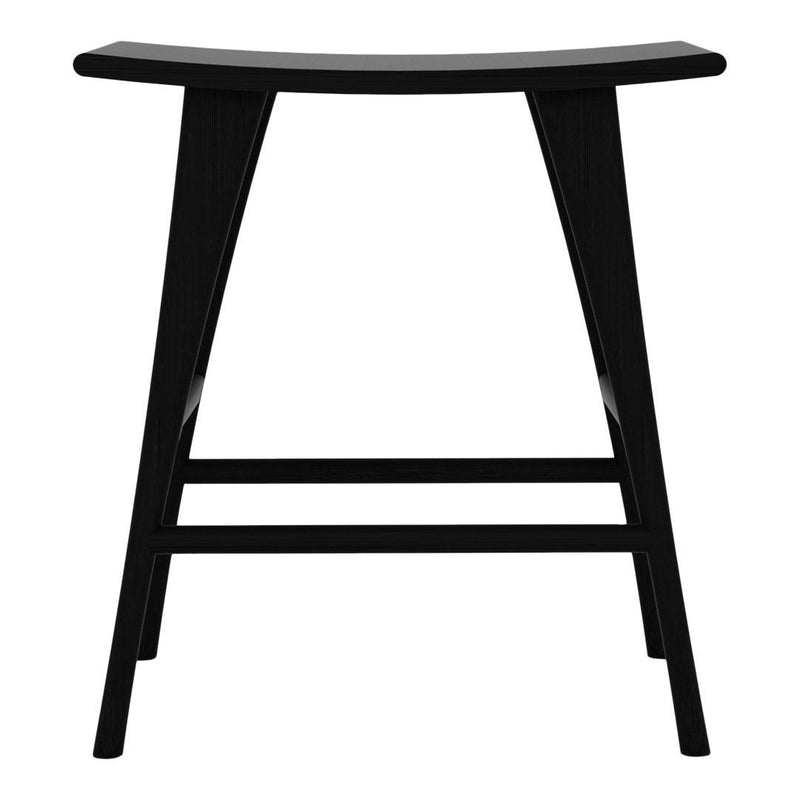 Black wooden stool with a smooth, curved top and tapered legs, featuring a minimalist design. 