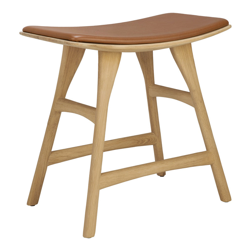 "Light wood stool with a curved design and a rich brown leather seat for a stylish, modern aesthetic."