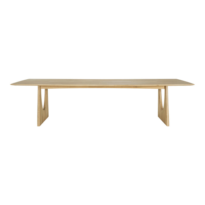 Minimalist wooden dining table in natural light oak finish with smooth, solid surface and clean lines.
