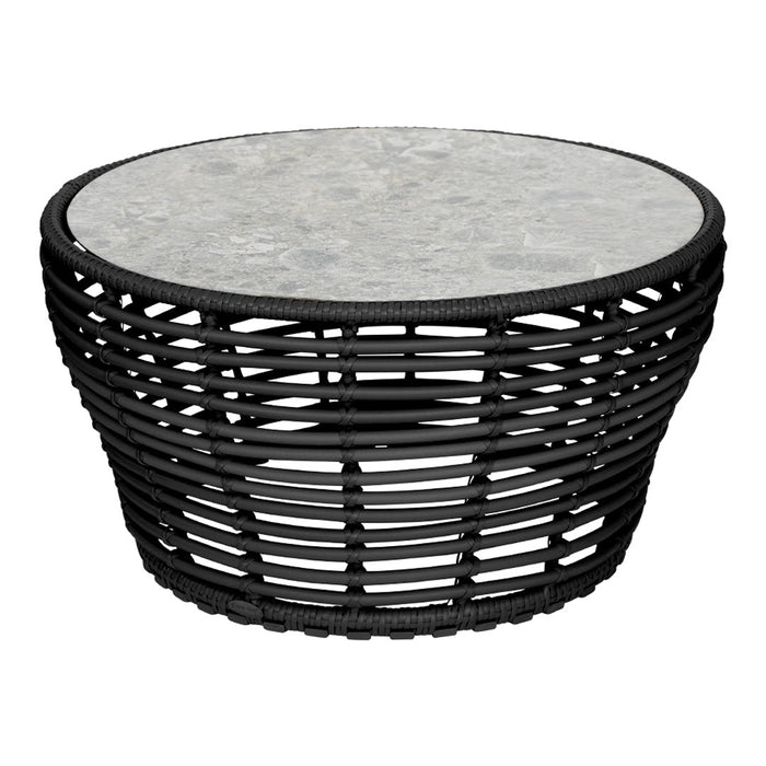 Black woven base coffee table with a round gray stone tabletop, featuring natural textures and a modern design.