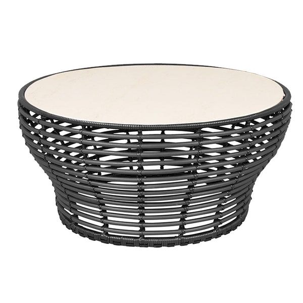 Black woven coffee table with a smooth cream-colored top and round shape, adding a modern touch to any decor.