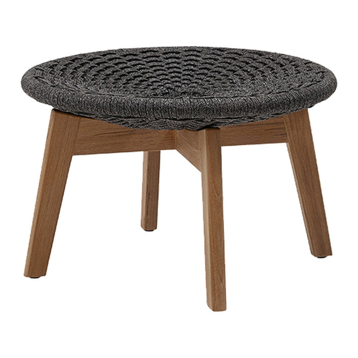 Round black woven table with a natural wood base, featuring a modern and minimalist design. Perfect for stylish decor.
