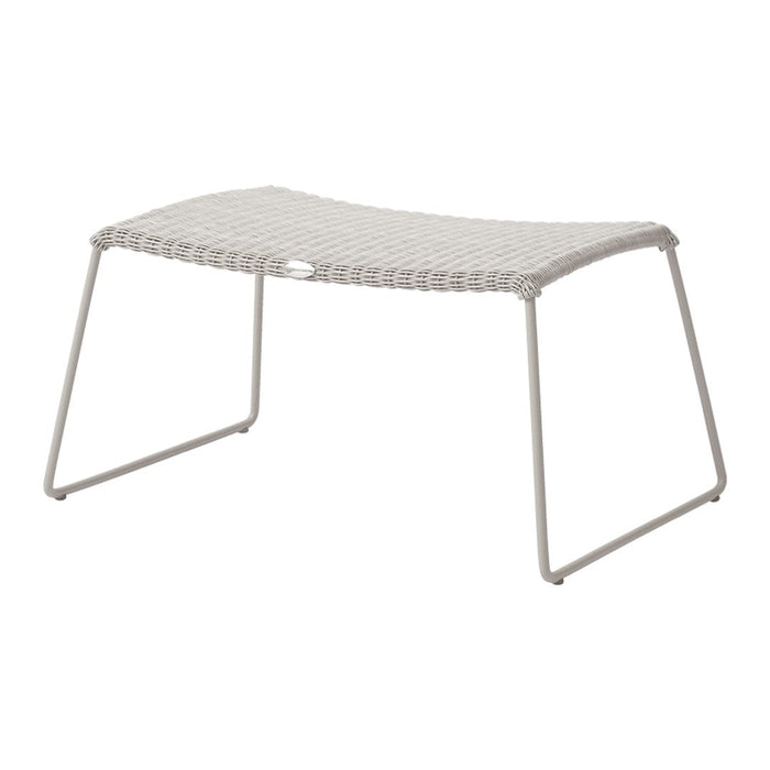 Light gray woven outdoor stool with a smooth, curved design and sturdy metal legs, perfect for cozy spaces.