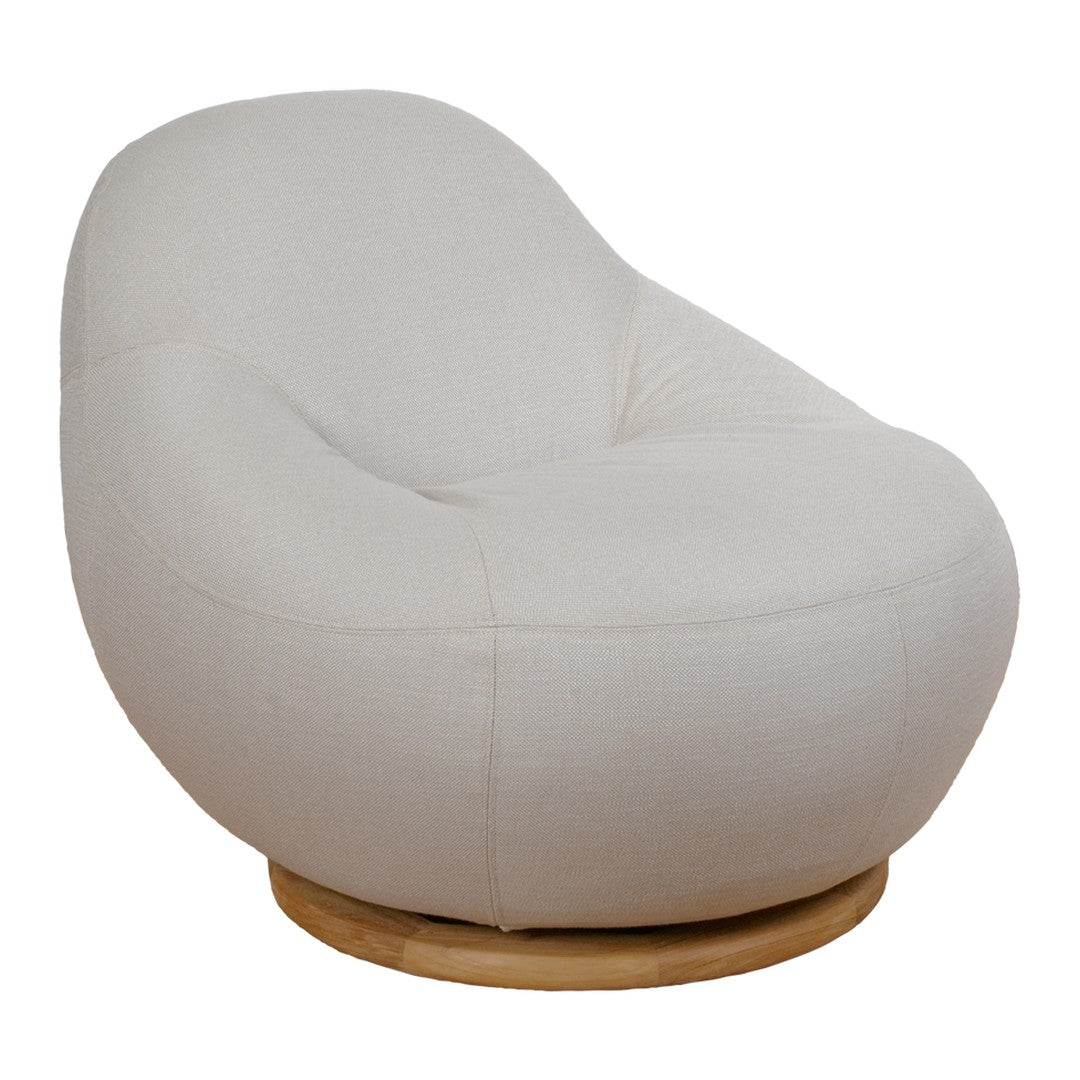 Light beige curved chair with smooth fabric and subtle stitching, resting on a natural wood swivel base.