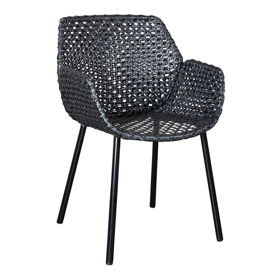 Black woven chair with intricate patterns and sleek black legs, ideal for modern decor.