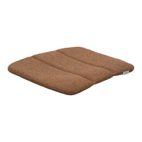Brown cushioned seat pad with a textured pattern, featuring three distinct sections for added comfort and style.