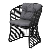 Black woven chair with gray cushion and tufted detailing, featuring a modern open pattern design.