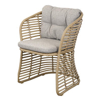 Beige woven chair with light gray cushions, featuring a modern, open pattern for a stylish touch.