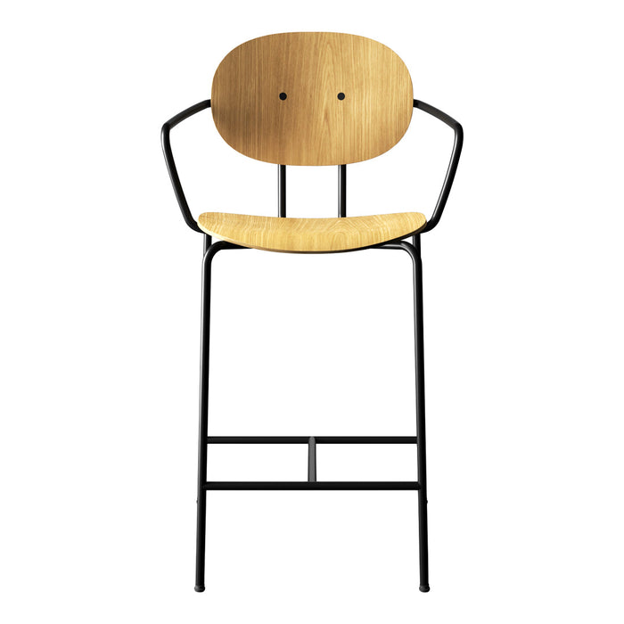 Wooden bar stool with a light bamboo seat and a sleek black metal frame. Modern and minimalist design.