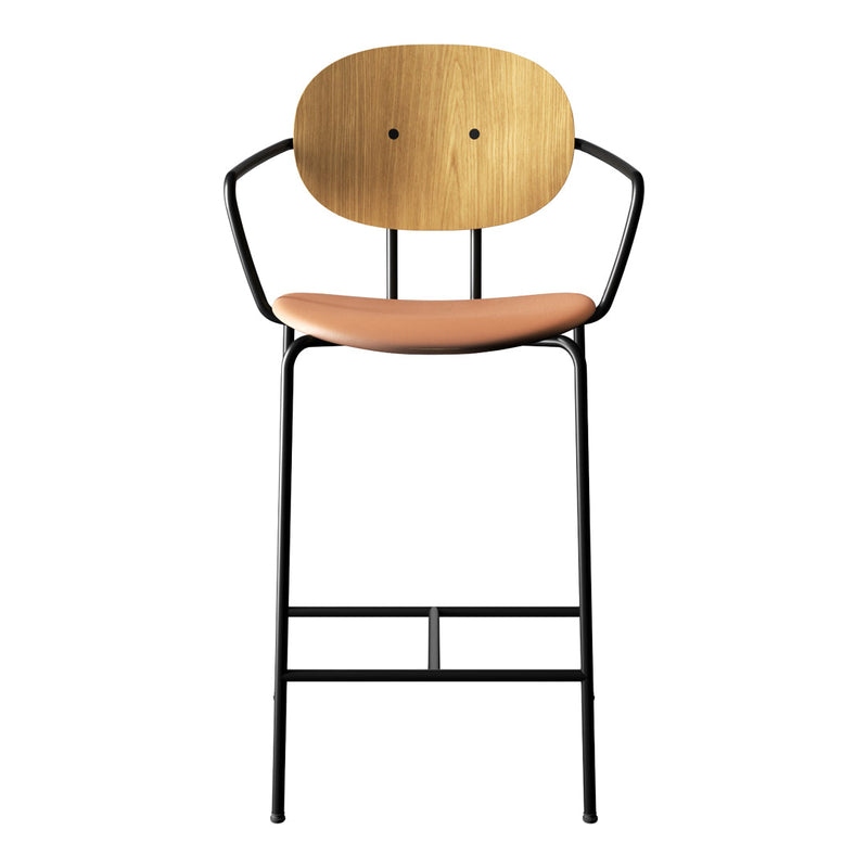 Stylish black metal bar stool with a natural wood backrest and a soft peach seat. Modern design for any space.