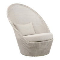 Beige woven lounge chair with a curved backrest and soft cushion, ideal for modern indoor or outdoor spaces.