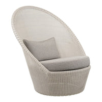 White woven chair with a curved design and light gray cushion. Elegant, modern aesthetics for stylish interiors.