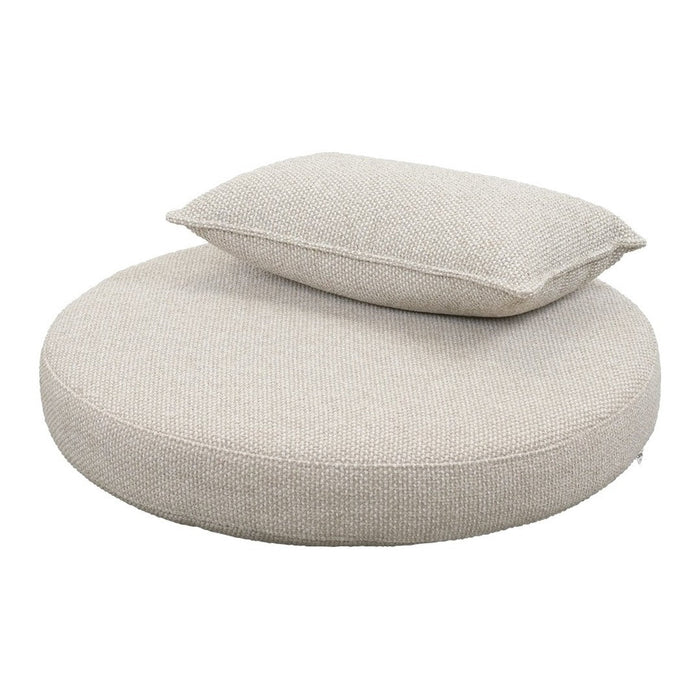 Round cream cushion with a soft, textured surface and a matching rectangular pillow on top. Perfect for stylish comfort.