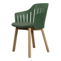 Green slatted chair with a textured green seat and natural wooden legs, showcasing a modern and stylish design.