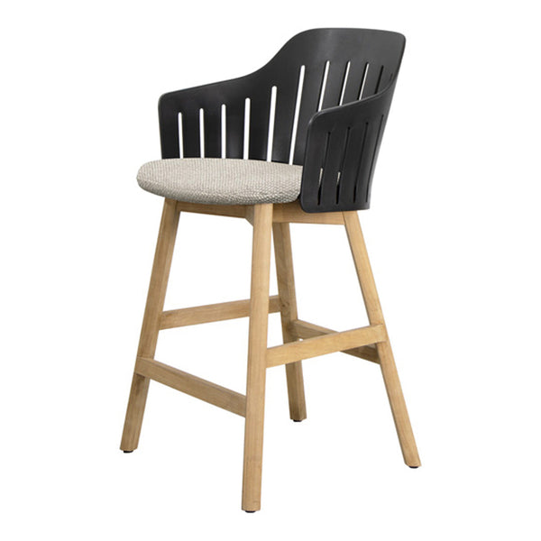 Modern black plastic bar chair with a light gray fabric seat and natural wood legs, featuring a slatted back design.