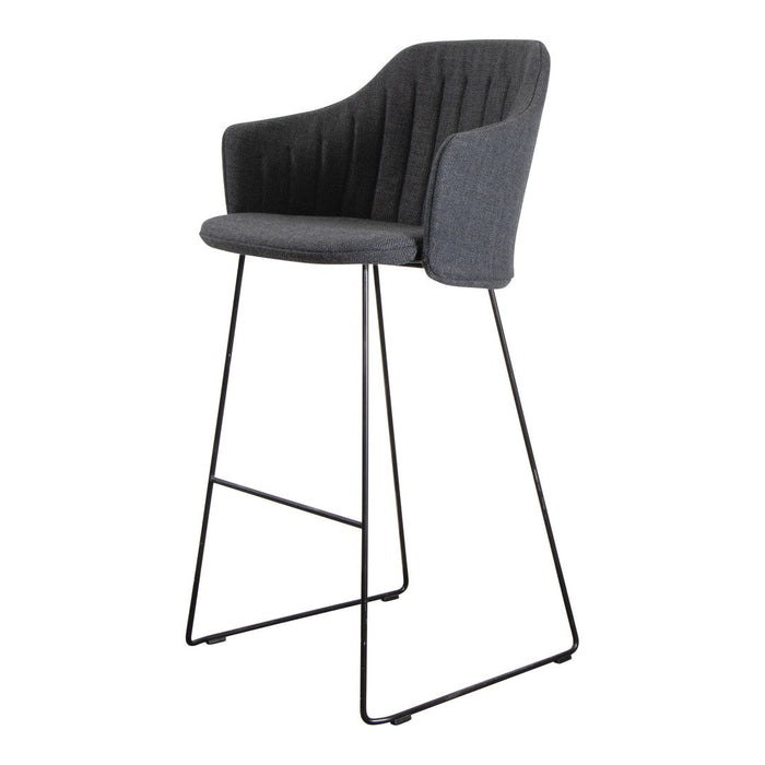 Modern gray upholstered bar stool with textured ribbed pattern and sleek black metal legs.