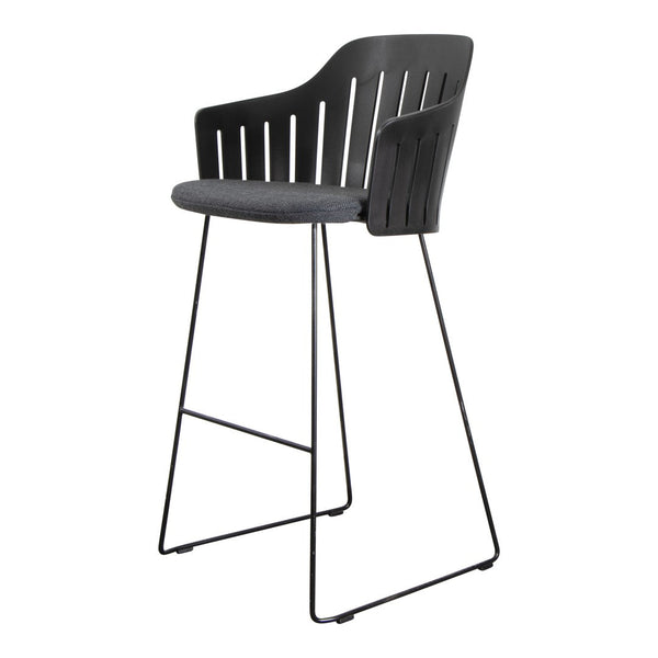 Black bar stool with a slatted backrest and gray cushioned seat, stylish metal legs for modern decor.
