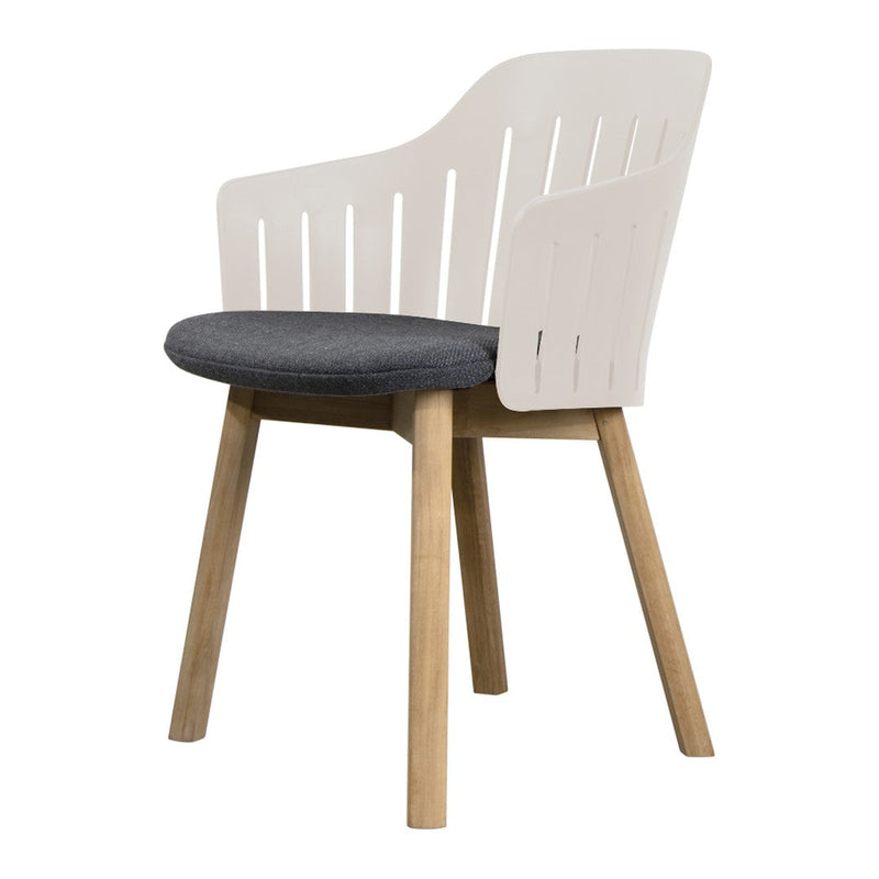 White slatted back chair with a dark gray cushion and natural wood legs, featuring a modern, minimalist design.