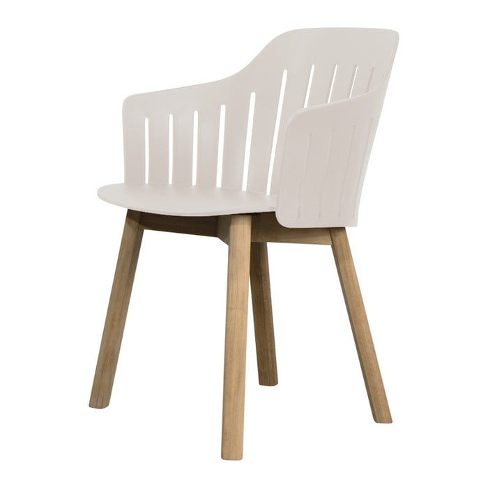 Modern white chair with slatted back and natural wood legs, featuring a sleek and minimalist design.