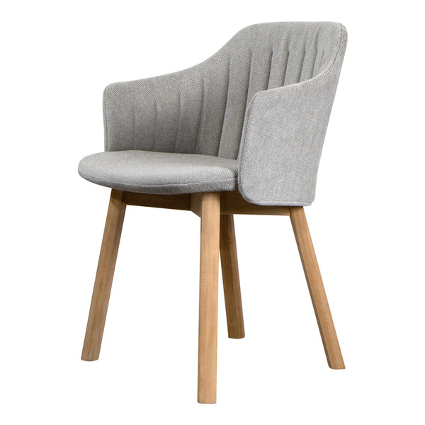 Gray upholstered chair with vertical ribbed pattern and light wooden legs. Modern, elegant design for home decor.
